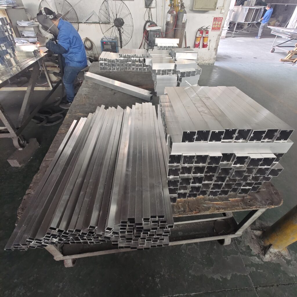 High-precision CNC cutting for custom gold aluminum cladding panels at Foshan factory.