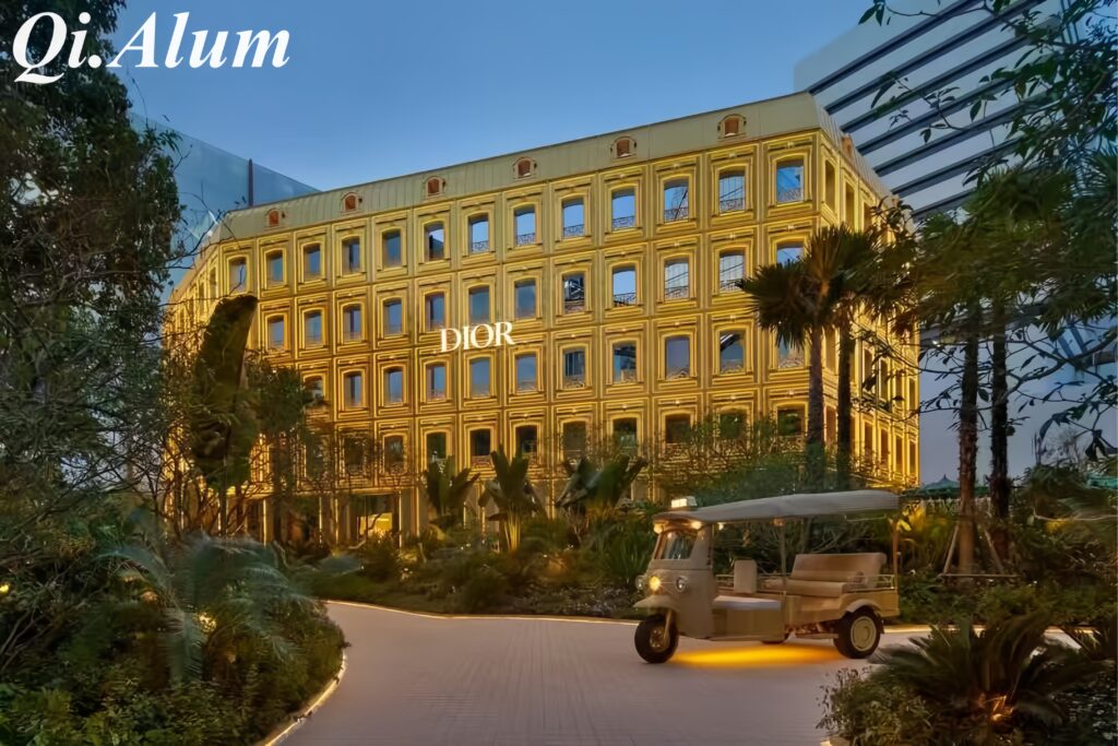 Breathtaking night view of DIOR luxury retail gold aluminum facade cladding in Thailand.